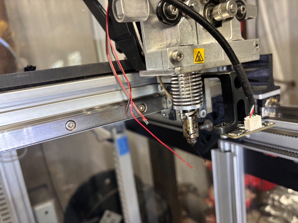 Custom 3D-printed Beacon Mount for Linear Rail holding a green beacon sensor board on a printer toolhead